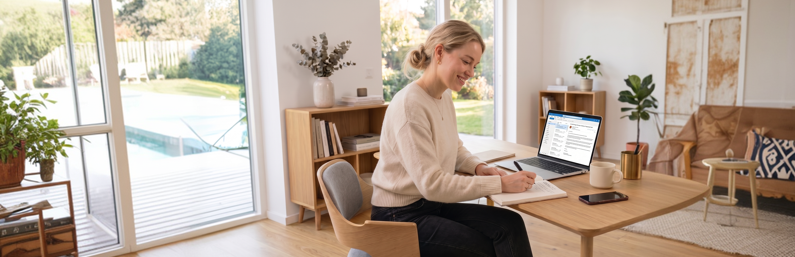 Brainway user writing in her journal at home - using the Brainway app to build daily productivity and focus habits