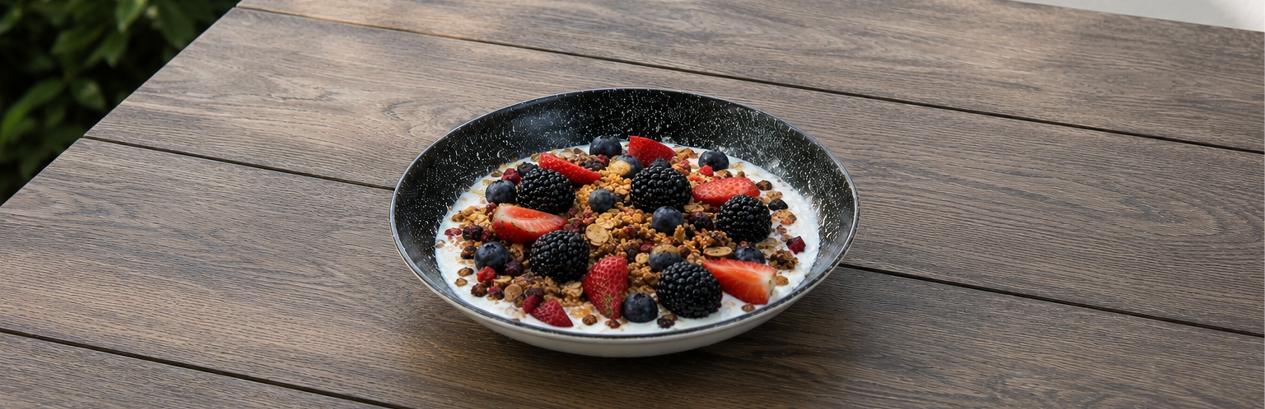 Greek Yogurt Berry Bowl - Greek yogurt topped with berries, chia seeds, almonds, and probiotic granola.